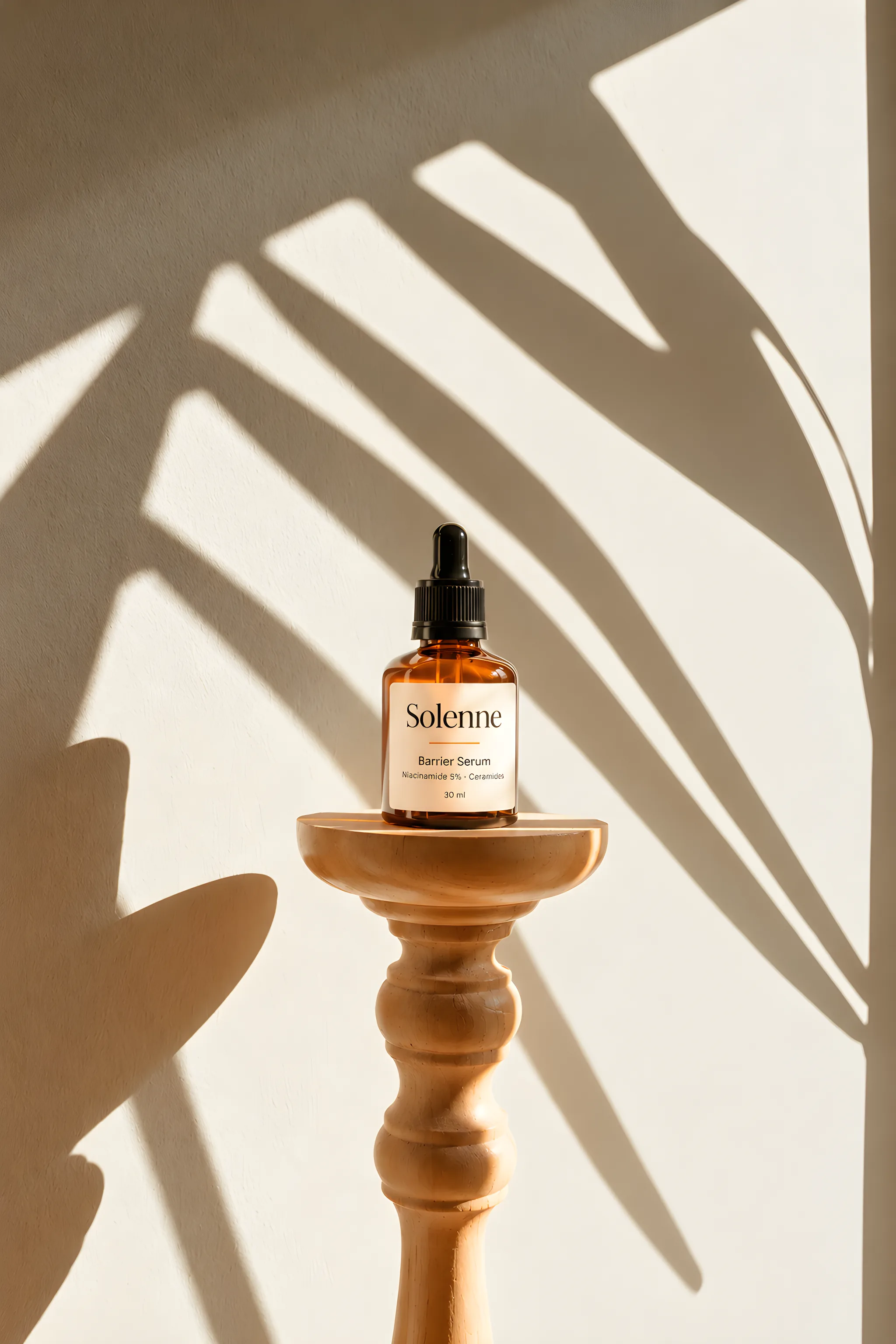 Barrier Serum on a turned wooden pedestal with palm shadows
