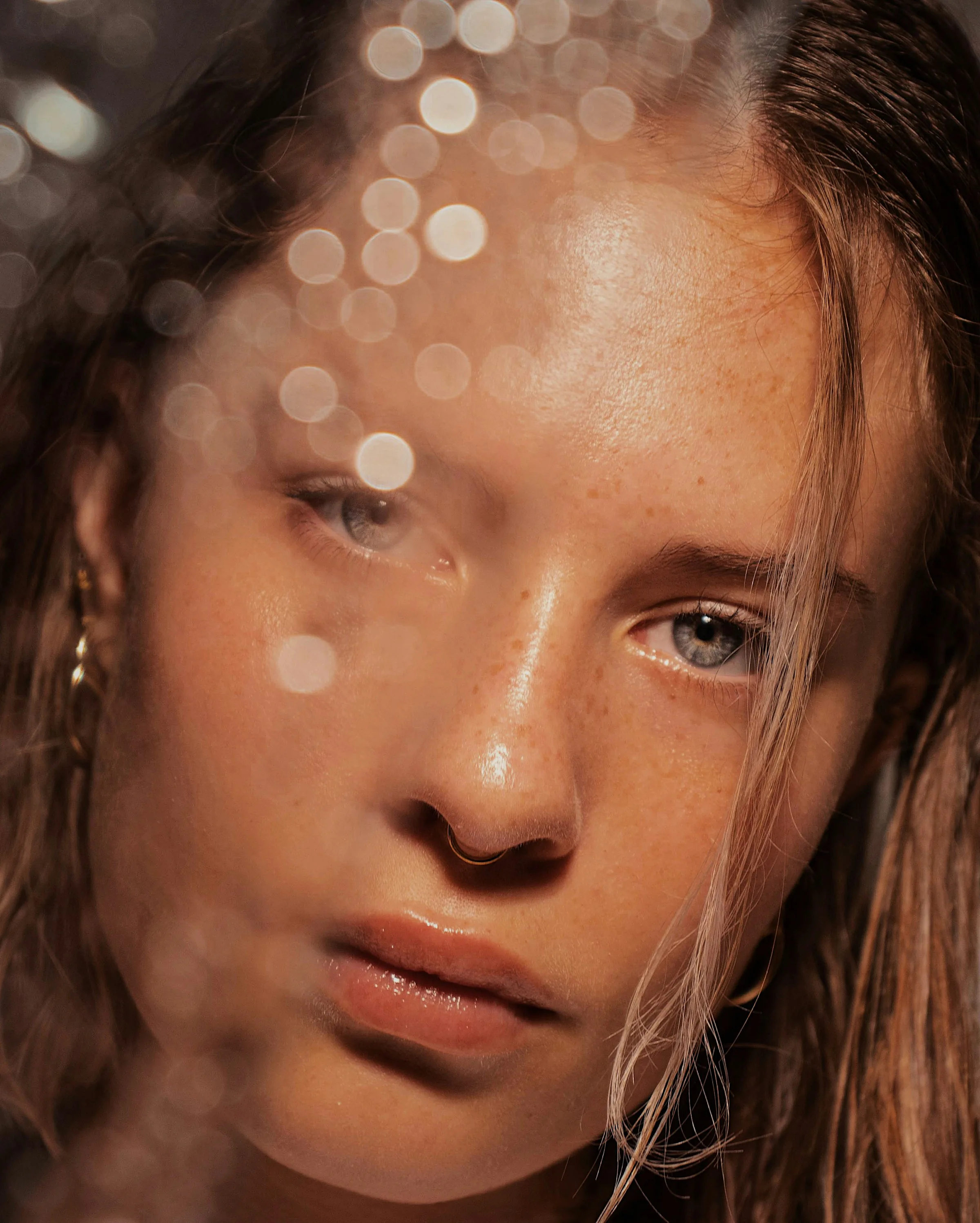 A freckled cheek in warm light